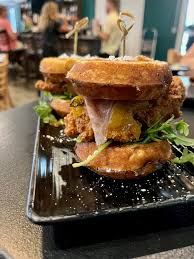 Front Porch Social signature dishes BBQ Burnt End Cannelloni, Zaza Shrimp, Hot Honey Sliders.